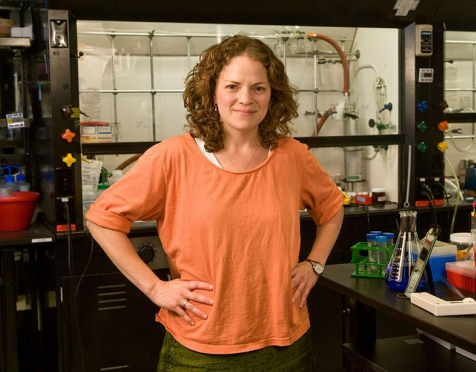 Photo of a female faculty member in a laboratory.