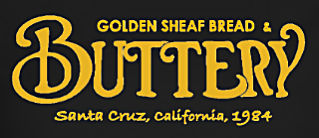 Image of gold text on black background reading Cafe Buttery and Golden Sheaf Bakery.