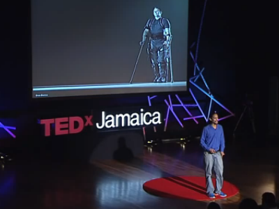 Joel Sadler delivering a TEDx talk about the JaipurKnee.