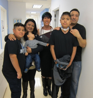 Photo of Jimenez family with Carol Conrad.