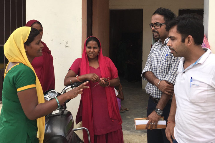 Biodesign fellows talking to citizens in India.