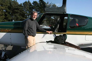Photo of Dr. James Spudich with a Trinidad plane.