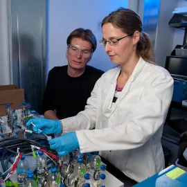 Woman and man in a lab setting.