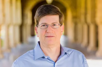 Mark Schnitzer standing outdoors at Stanford