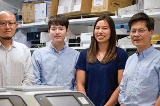 Photo of the 4 researchers inside the lab.