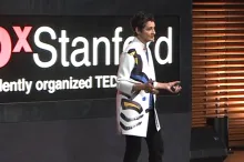 Dr. Carla Shatz delivering the TEDxStanford talk.