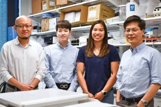 Photo of the 4 researchers inside the lab.