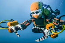 Photo of OceanOne robot in the water.