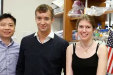 Photo of Dong Wang, Gregory Scherrer, and Elizabeth Sypek in the laboratory.