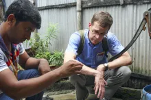 Photo of Dr. Stephen Luby with a teammate in Dhaka, Bangladesh, testing water samples.