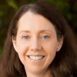 Photo of smling white female faculty member, Dr. Allison Kurian, Professor of Medicine and Epidemiology at Stanford University.