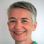 Photo of a smiling white female faculty member with short gray hair, Dr. Birgitt Schuele, Associate Professor of Pathology at Stanford University.