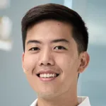 Headshot photo of a smiling Asian male faculty member, Dr. Brian Hie, Assistant Professor of Chemical Engineering at Stanford University.
