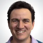 Photo of smiling male faculty member, Dr. Carlos Guestrin, Professor of Computer Science at Stanford University.