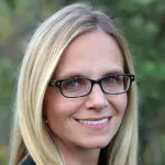 Photo of smiling white female faculty member with shouluder-length blonde hair and glasses, Dr. Christina Curtis, Professor of Medicine, Genetics, and Biomedical Data Science at Stanford University.