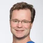 Headshot portrait of Doff McElhinney - Professor of Cardiothoracic Surgery (Pediatric Cardiac Surgery) and of Pediatrics (Cardiology)