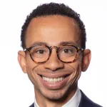 Headshot photo of a smiling Black male faculty member, Dr. Westley Phillips, Assistant Professor of Neurosurgery at Stanford University.