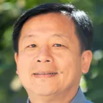 Photo of smiling Asian male faculty member, Dr. James Dunn, Professor of Surgery at Stanford University.