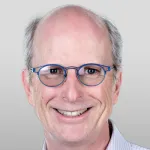 Headshot portrait of John Boothroyd - Burt & Marion Avery Professor of Immunology, Emeritus