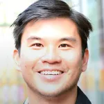 Photo of smiling Asian faculty member Dr. Mathew Kiang, Assistant Professor of Epidemiology and Population Health at Stanford University.