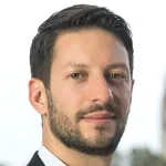 Photo of a smiling white male faculty member with short dark hair and a short beard, standing outdoors, Dr. Matteo Cargnello, Associate Professor of Chemical Engineering at Stanford University.