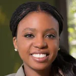 Photo of smiling Black female faculty member, Dr. Michaelle Mayalu, Assistant Professor of Mechanical Engineering at Stanford University.