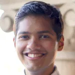Photo of smiling male undergraduate student Ayush Pandit.