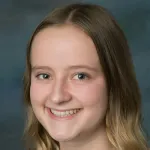 Photo of smiling female undergraduate student Alina Pollner.