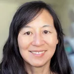 Photo of smiling Asian female faculty member, Dr. Priscilla Yang, Professor of Microbiology & Immunology at Stanford University.