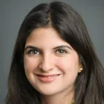 Headshot photo of a smiling female faculty member with long dark hair, Dr. Roxana Daneshjou, Assistant Professor of Biomedical Data Science and Dermatology at Stanford University.