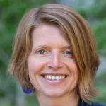 Outdoor headshot photo of smiling white female faculty member, Dr. Ruth Huttenhain, Assistant Professor of Molecular & Cellular Physiology at Stanford.