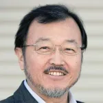 Outdoor headshot photo of a smiling Asian male faculty member, Dr. Soichi Wakatsuki, Professor of Photon Science and Structural Biology at Stanford University.