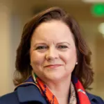 Indoor headshot photo of a smiling white female faculty member, Dr. Trisha Suppes, Professor of Psychiatry and Behavioral Sciences at Stanford University.