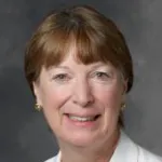 Indoor headshot photo of smiling white female faculty member, Dr. Susan Knox, Associate Professor of Radiation Oncology Emerita at Stanford University.