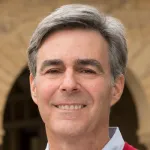 Photo of smiling white male faculty member with short gray hair, Dr. Thomas Robinson, Professor of Pediatrics and Medicine at Stanford University.