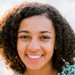 Photo of smiling female undergraduate student Ameera Waterford.