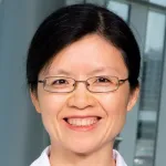 Headshot photo of smiling Asian female faculty member, Dr. Xuejun Gu, Associate Professor of Radiation Oncology at Stanford University.