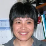 Indoor headshot photo of a smiling Asian female faculty member, Dr. Yanmin Yang, Associate Professor of Neurology at Stanford University.