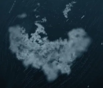 Image of a blob of white fluffy-looking material in the center with other bits around it, on a dark blue watery background.