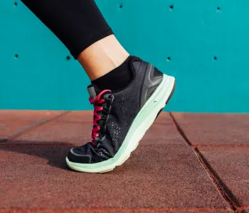 Photo of a person's foot in an athletic shoe.