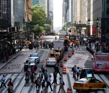 Photo of a busy crosswalk in New York City.