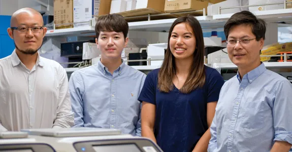 Photo of the 4 researchers inside the lab.