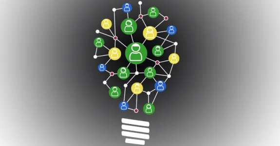 Graphic image of lightbulb composed of different icons of people to indicate crowdsourced idea.
