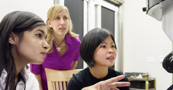 Photo of graduate student Fariah Hayee, Professor Jen Dionne and senior research scientist Ai Leen Koh in the lab.