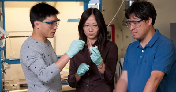 Photo of postdoctoral fellow Guihua Yu, Associate Professor Zhenan Bao and visiting scholar Lijia Pan.