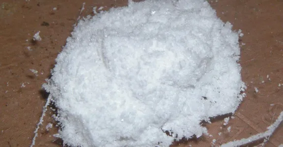 Photo of a small pile of white ketamine powder.