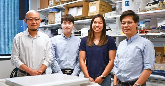 Photo of the 4 researchers inside the lab.