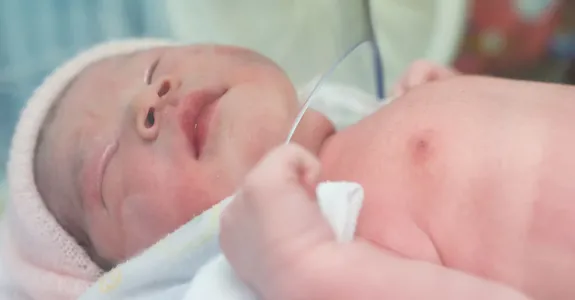 Photo of newborn baby in hospital.