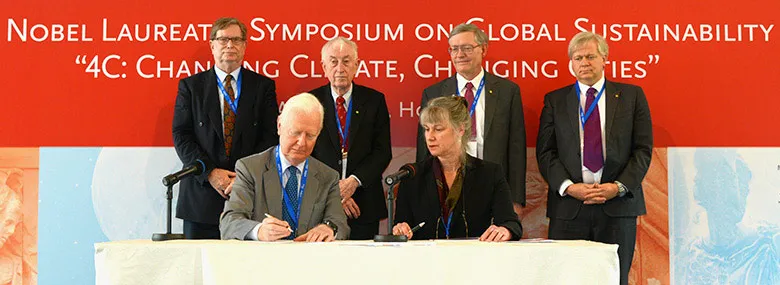 Nobel laureates, from left, standing: George Smoot, Peter Doherty, W.E. Moerner, Brian Schmidt; and seated, James Mirrlees, join memorandum team leader Penny Sackett in Hong Kong on April 25.