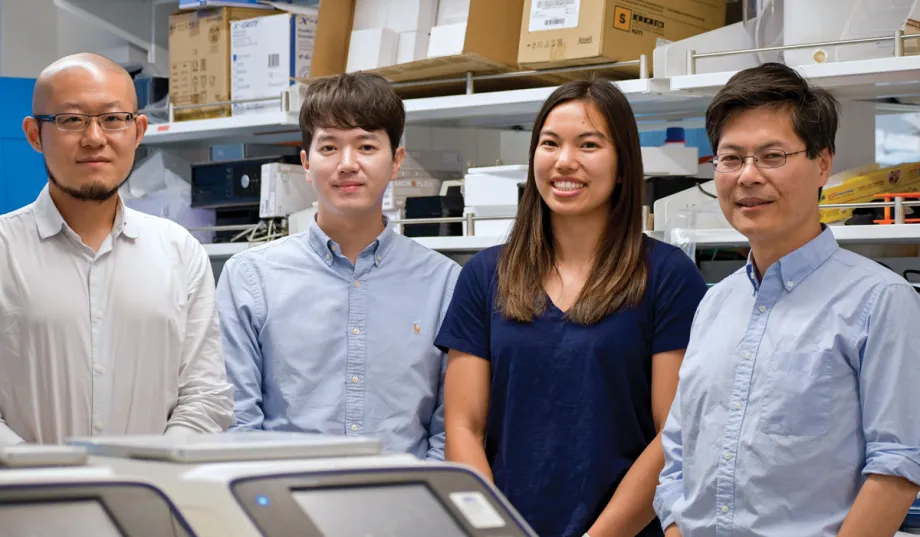 Photo of the 4 researchers inside the lab.